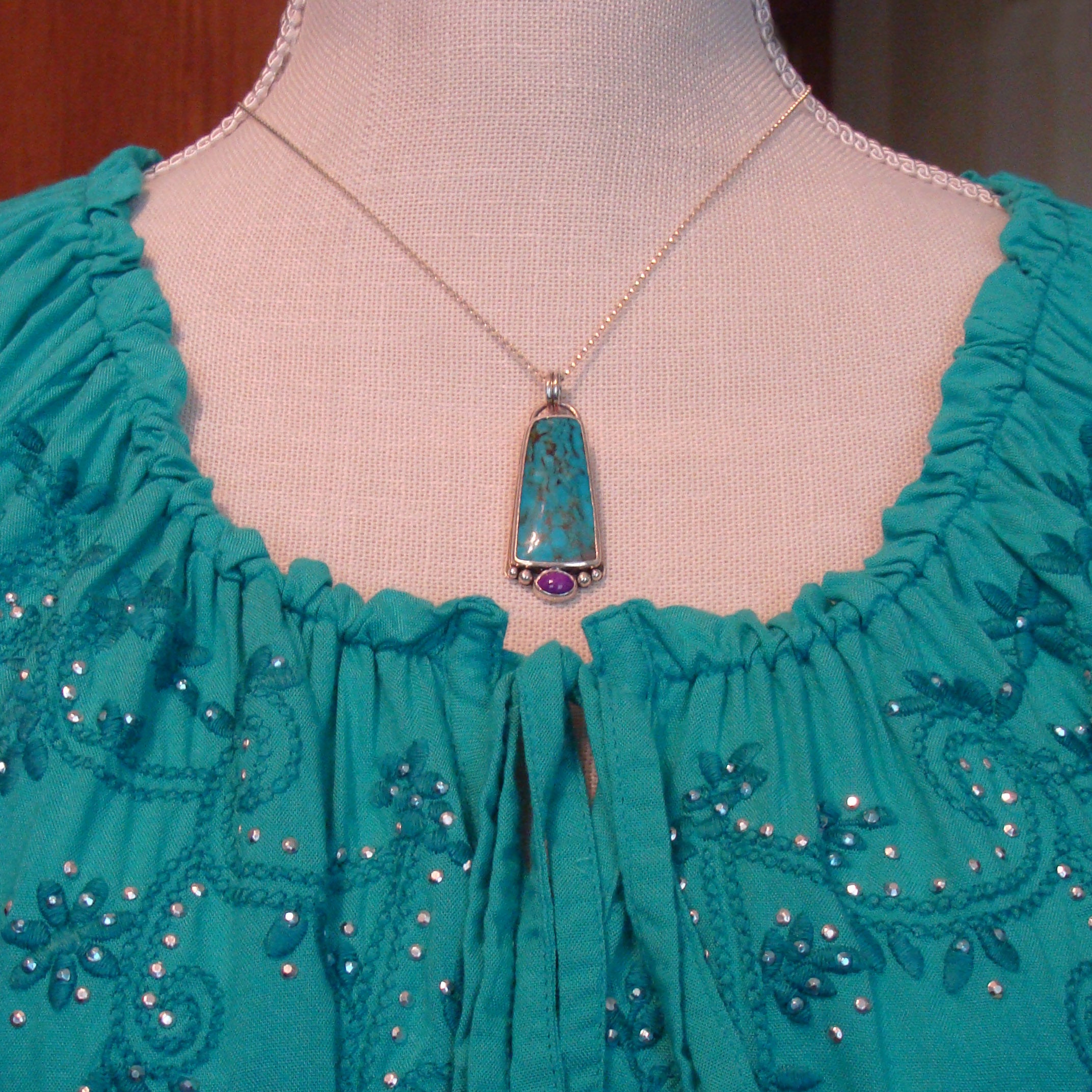 bisbee turquoise and sugilite pendant on mannequin