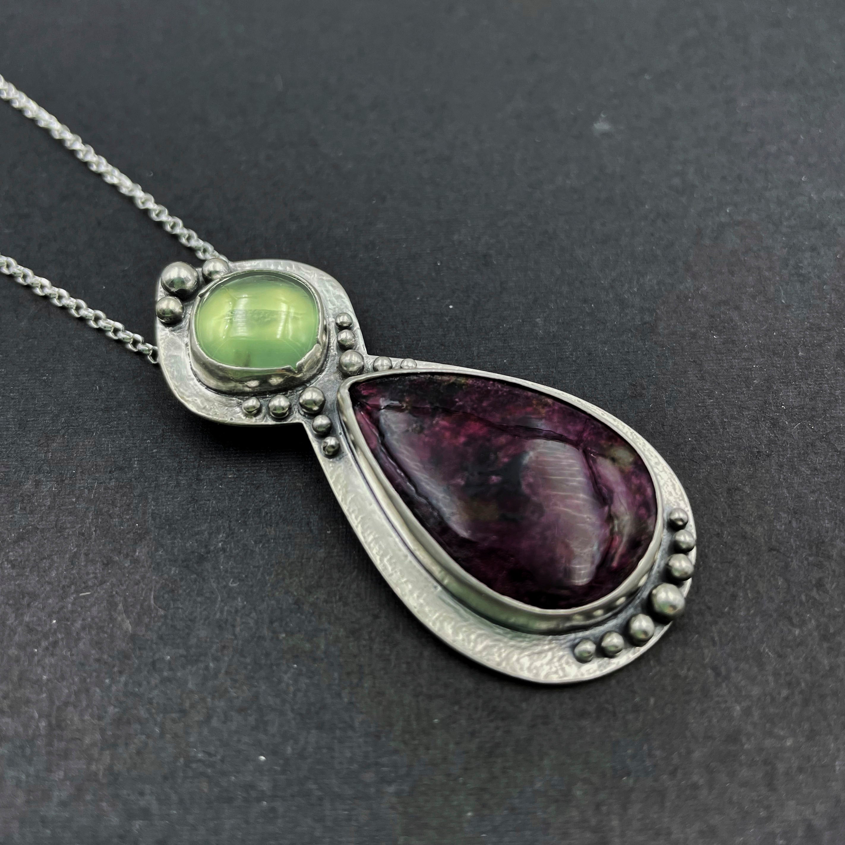 eudialyte and peridot pendant left side view