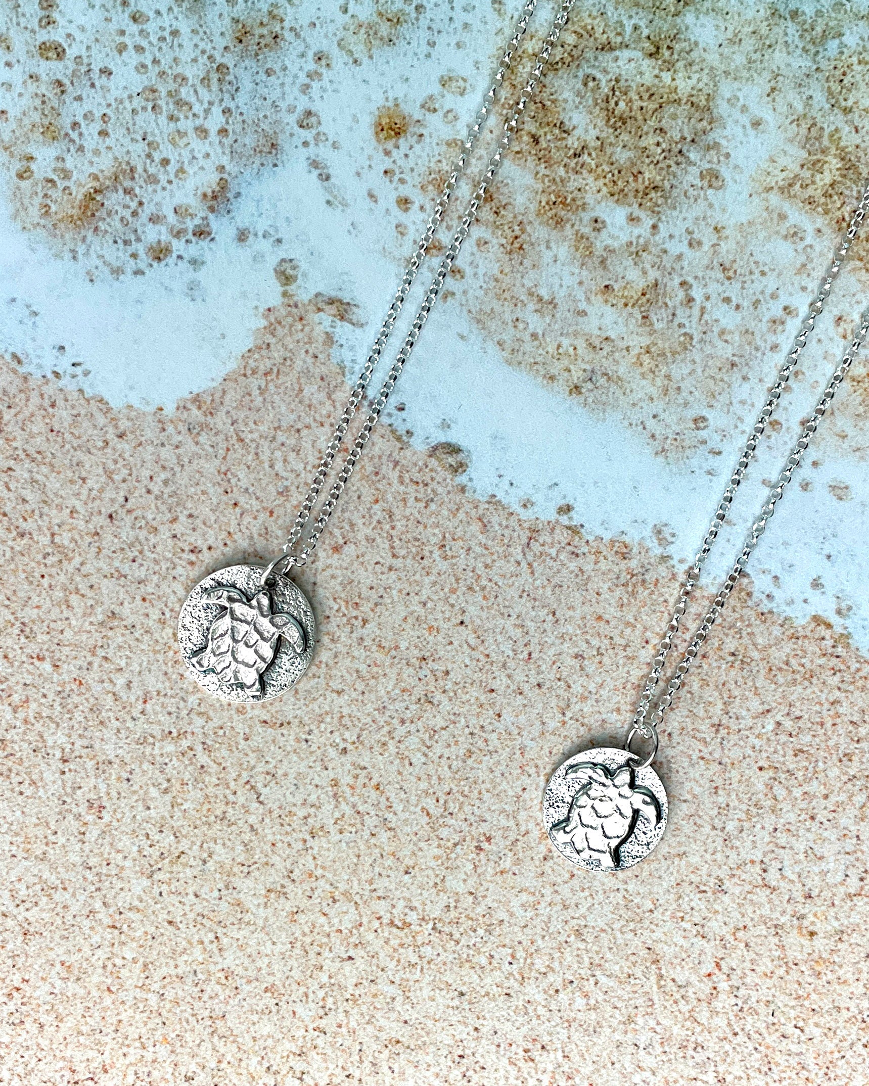 round sea turtle pendant flat lay both sizes